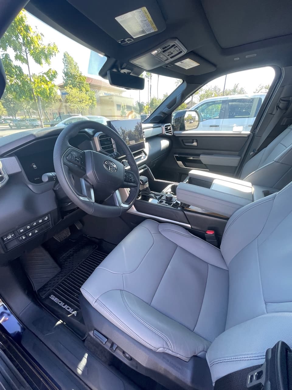 Front cabin of the 2026 Toyota Sequoia with leather seats and a large touchscreen