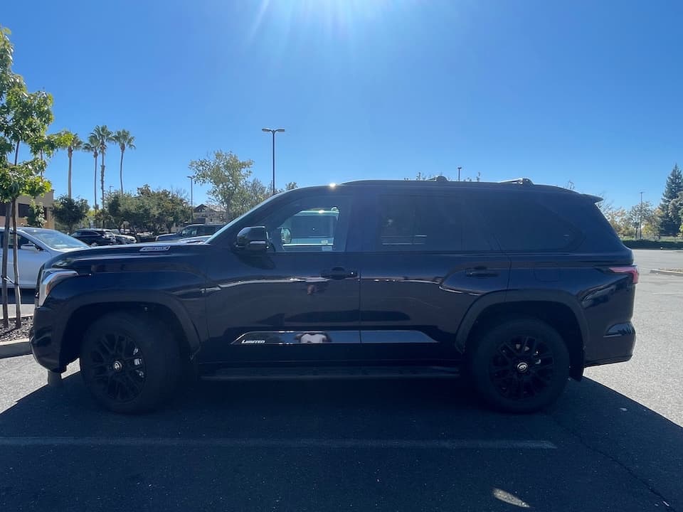 Dark blue 2026 Toyota Sequoia SUV, side profile from the driver's side