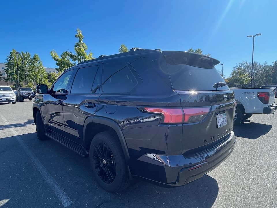 Dark blue 2026 Toyota Sequoia SUV, rear three-quarter view showing the tailgate