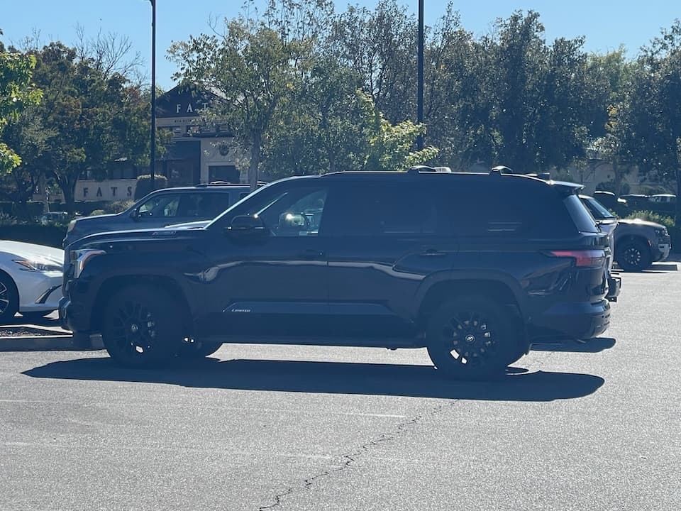 Dark blue 2026 Toyota Sequoia SUV, side profile in the shade